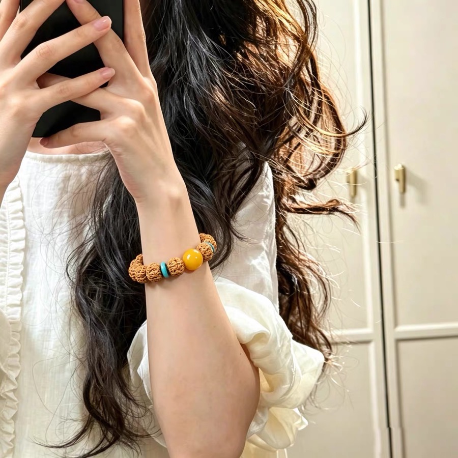 Customer-shared photo of Bodhi bead bracelet worn in sunlit daily outfit
